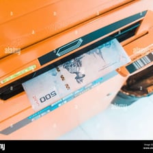 An automated teller machine dispensing paper money