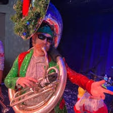A tuba player performing in a polka band.