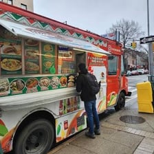 A taco truck serving food on a city street