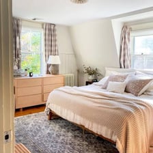 A bed arranged in a bedroom.