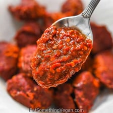 Red adobo sauce containing chipotle peppers