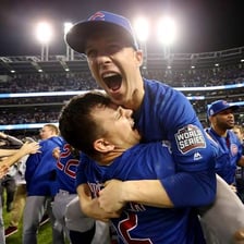A sports team celebrating together with visible enthusiasm.