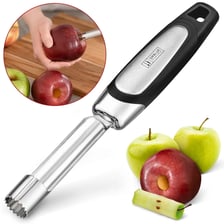 A handheld kitchen apple corer beside an apple.