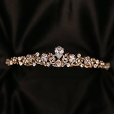 Several small jeweled tiaras displayed together