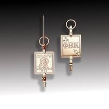 The Phi Beta Kappa key bearing the society’s Greek letters.