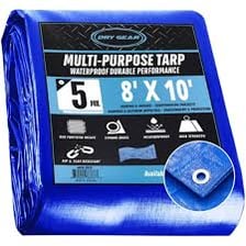 A blue tarp protecting equipment outdoors.