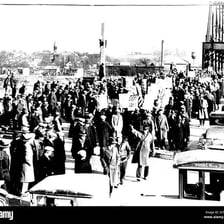 A large crowd moving into a city or venue.