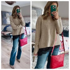 A camisole worn as a layering piece under a sweater