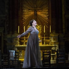 Opera singer performing on the stage of the Metropolitan Opera.
