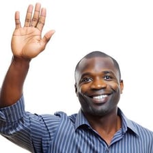 A person lifting one hand upward.