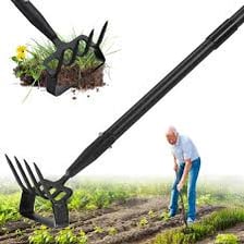 A garden hoe resting in cultivated soil.