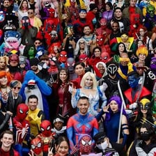 Attendees at a Comic-Con convention, including comic-book cosplay.