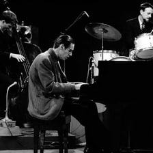Three musicians performing as a small jazz combo