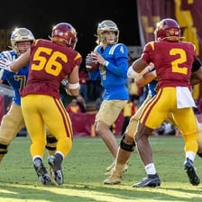 American football offensive lineman protecting a quarterback