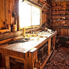 A cluttered interior of a barn