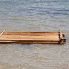 A small raft floating on the surface of the sea
