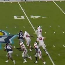 A football player scoring a touchdown during a televised game