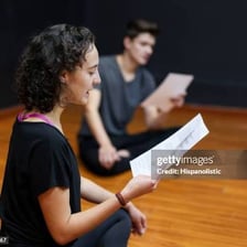 Actor holding a script on a film set