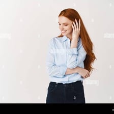 A person with a reserved, bashful expression.