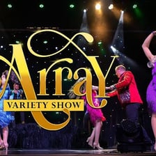 A theater stage set for a variety revue.