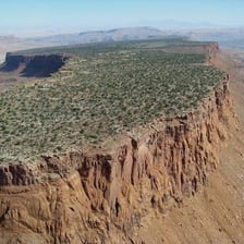 Flat-topped mesas rising from a desert landscape