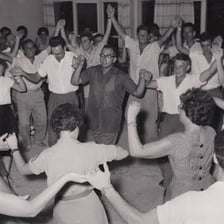 Guests performing a Jewish hora in a circle.