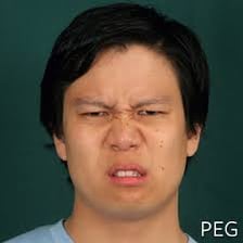 A person making a disgusted expression in reaction to something unpleasant.