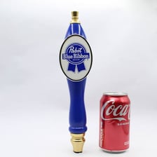 A bar counter with beer taps, including craft beer and PBR.