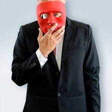 A person in disguise symbolizing deception or fraud.