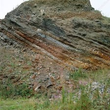 A mineral-rich vein running through surrounding rock.