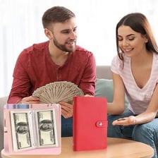 A person counting a stack of cash.