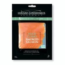 Slices of lox, or smoked salmon, in a smokehouse setting