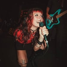 A rapper performing emotionally expressive music.