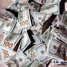 A stack of paper money representing cash.