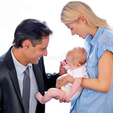An adult showing affectionate attention to a child