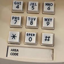 An office telephone displaying an extension number