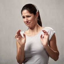 A person making a disgusted facial expression.