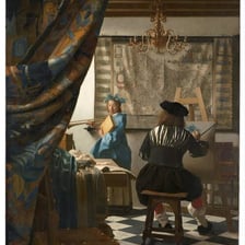 An artist carefully demonstrating a skilled technique