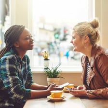 Two people sharing information in a conversation.