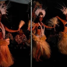 Hula dancer performing in traditional costume