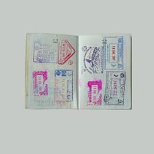A passport page bearing a visa stamp.
