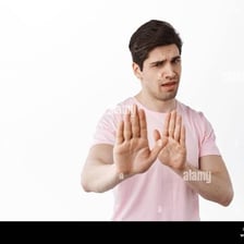 A reluctant person gesturing that they do not want to proceed