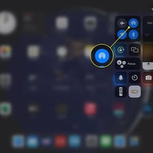 An Apple iPad displaying the AirDrop sharing interface.
