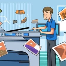 A person glancing over a printed document.