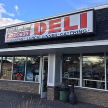 A neighborhood deli with a sandwich counter.