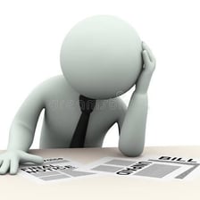 A person reviewing bills and debt statements