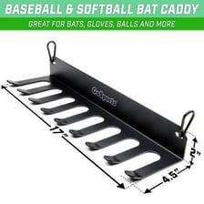 Several softball bats resting together in a dugout.