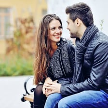 A couple looking at each other affectionately.