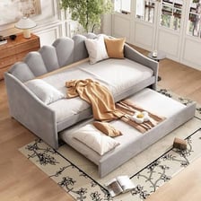 A daybed arranged as seating in a room