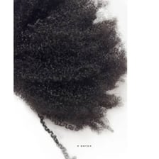 Close-up of tightly coiled 4c natural hair